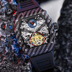 Luxury carbon fiber skeleton chronograph watch with intricate gold tourbillon movement.