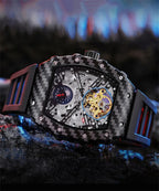 Luxury carbon fiber skeleton chronograph watch with gold-tone mechanical movement.