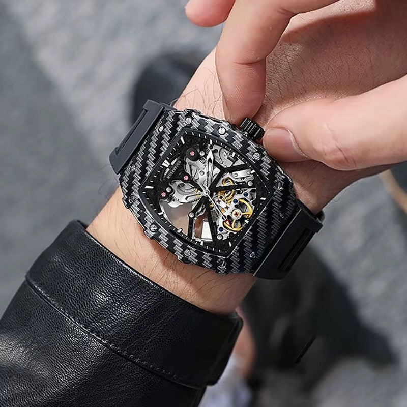 Luxury carbon fiber skeleton chronograph watch with racing-inspired design on a man's wrist.