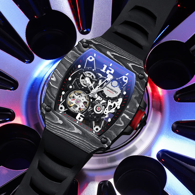 Luxury racing-inspired chronograph watch with carbon fiber texture and black rubber strap.